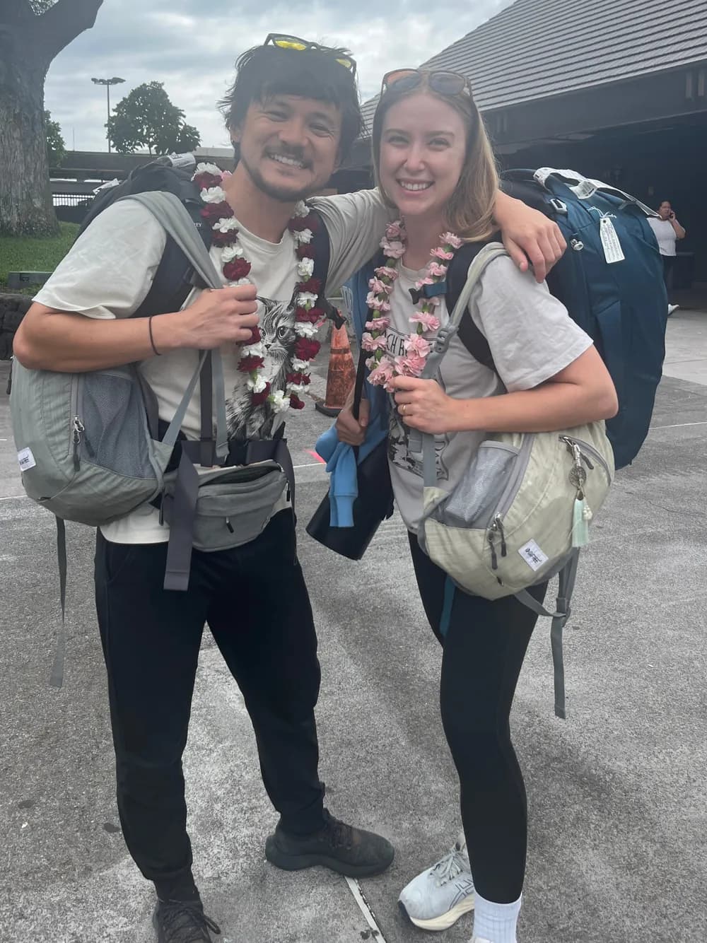 Tyler and Kat at the airport after their world tour